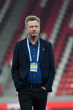 Peter Gerhardsson, head coach of Sweden, inspects the pitch