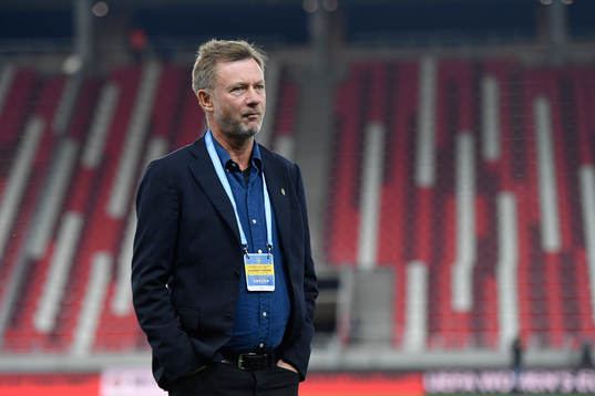 Peter Gerhardsson, head coach of Sweden, inspects the pitch