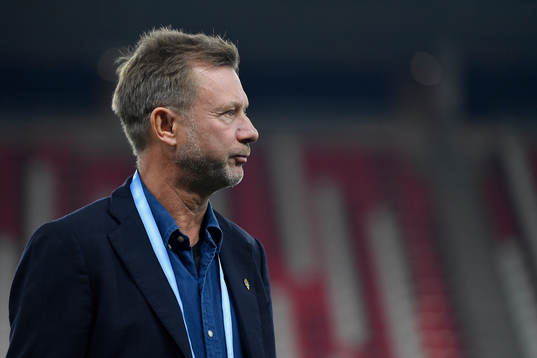 Peter Gerhardsson, head coach of Sweden, inspects the pitch