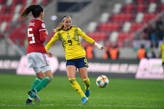 Kosovare Asllani of Sweden vies against Zsofia Racz of