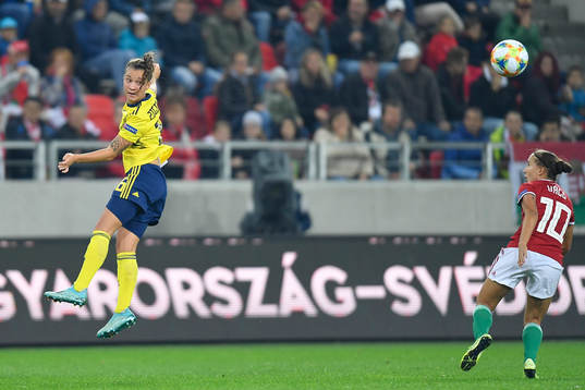 Madelen Ericsson of Sweden vies against Fanni Vago of