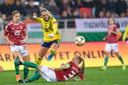 Kosovare Asllani of Sweden vies against Henrietta Csiszar