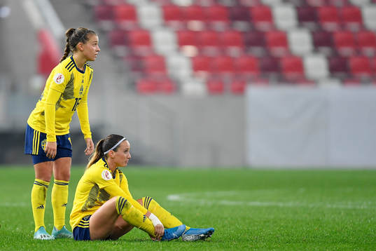 Kosovare Asllani and Julia Zigiotti Olme of Sweden react