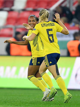 Madelen Janogy and Magdalena Ericsson of Sweden celebrate