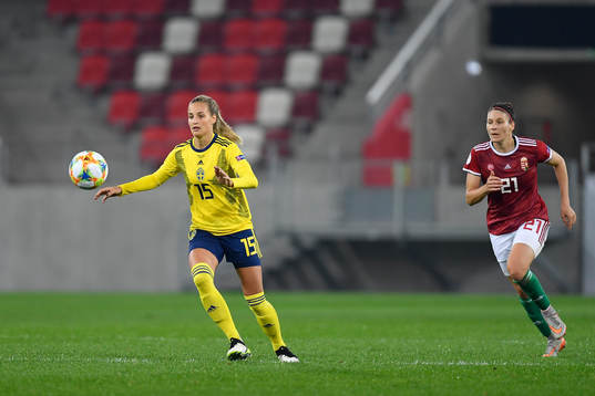 Nathalie Bjorn of Sweden vies against  Bernadette Zagor of