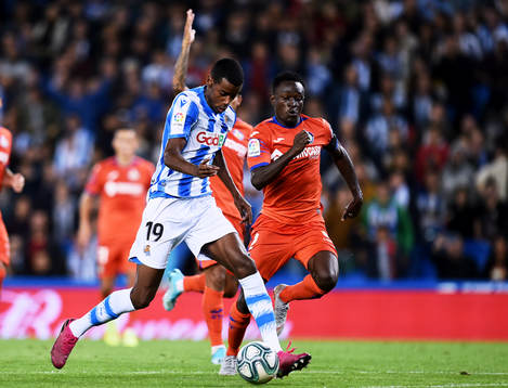 Alexander Isak of Real Sociedad battles for the ball with