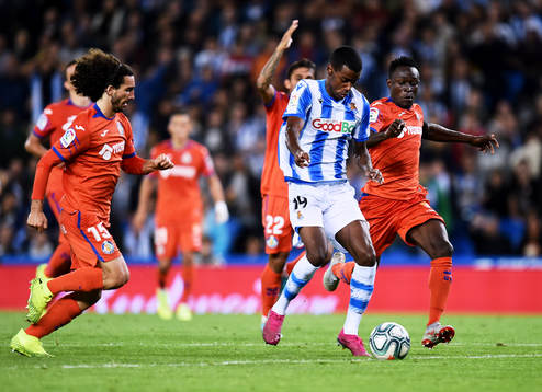 Alexander Isak of Real Sociedad battles for the ball with
