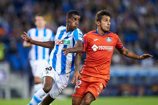 Alexander Isak of Real Sociedad dispute the ball with