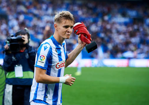 Xavi Prieto gives Martin Odegaard of Real Sociedad the