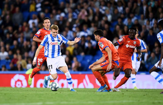 Martin Odegaard of Real Sociedad battles for the ball with