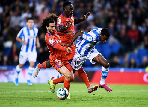 Alexander Isak of Real Sociedad battles for the ball with