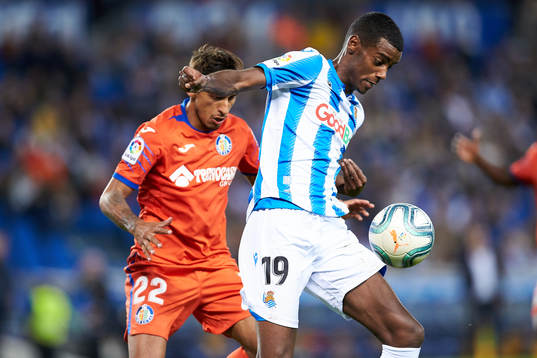 Alexander Isak of Real Sociedad dispute the ball with