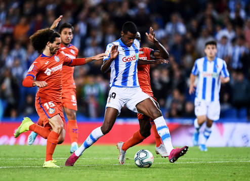 Alexander Isak of Real Sociedad battles for the ball with