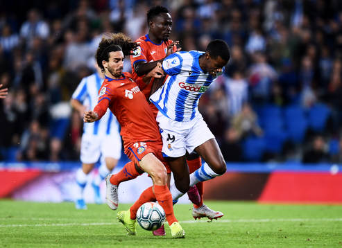 Alexander Isak of Real Sociedad battles for the ball with