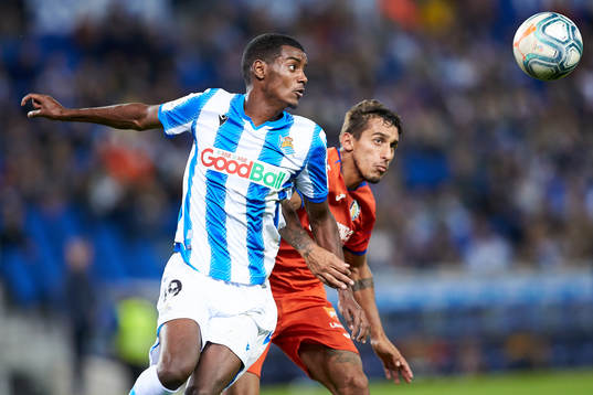 Alexander Isak of Real Sociedad dispute the ball with