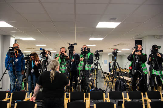 Journalists prepare their cameras