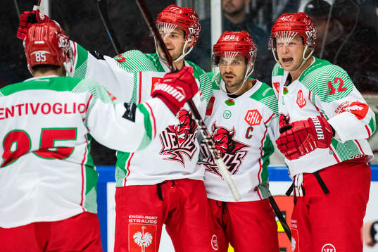 Joey Martin of Cardiff (M) celebrate with team mates