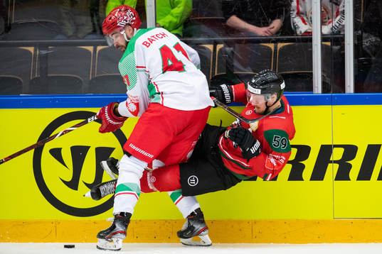 Josh Batch of Cardiff hits Simon Hjalmarsson of Frölunda