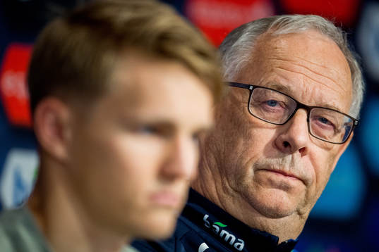 Lars Lagerbäck, head coach of Norway, listens to Martin