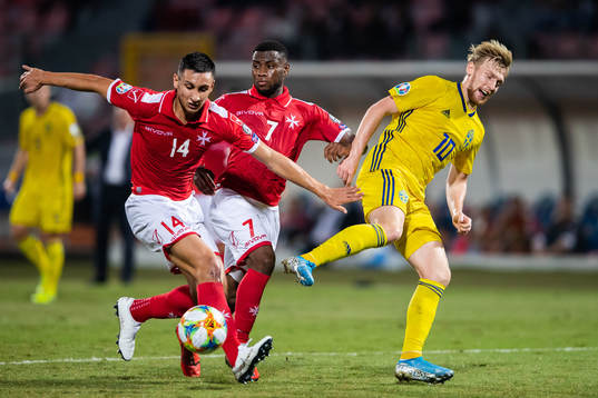 Kurt Shaw and Joseph Mbong of Malta against Emil Forsberg