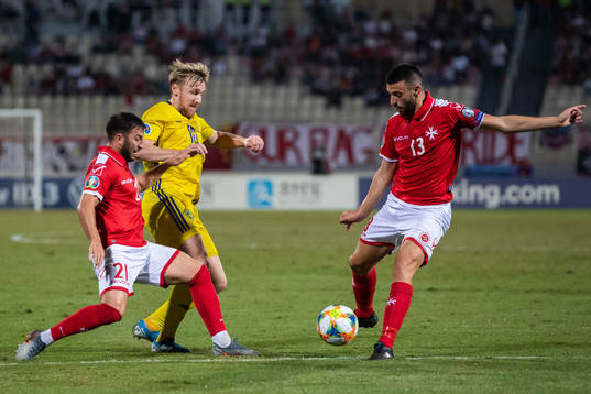Luke Gambin and Dusten Vella of Malta against Emil Forsberg