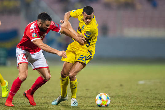 Zach Muscat of Malta and Robin Quaison of Sweden