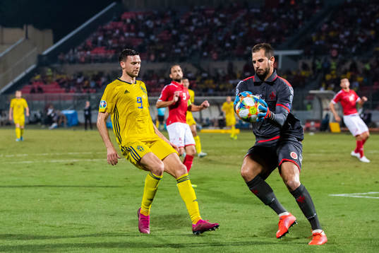 Marcus Berg of Sweden and goalkeeper Henry Bonello