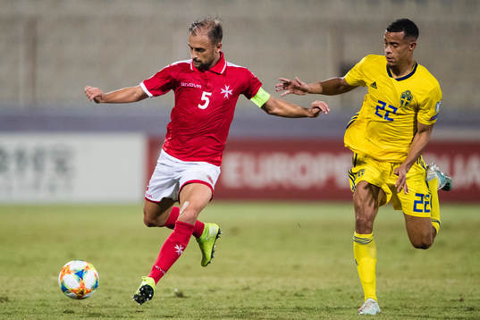 Andrei Agius of Malta and Robin Quaison of Sweden
