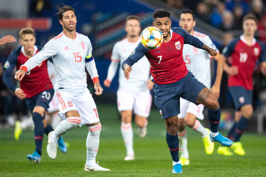 Sergio Ramos of Spain and Joshua King of Norway