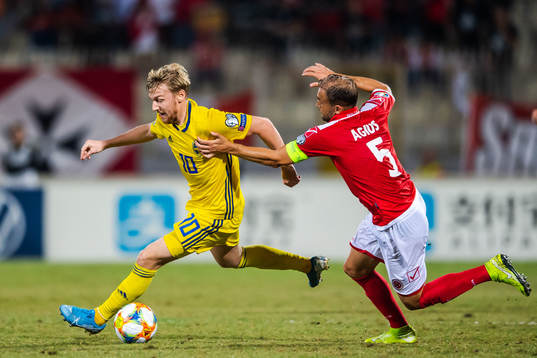 Emil Forsberg of Sweden and Jake Grech of Malta