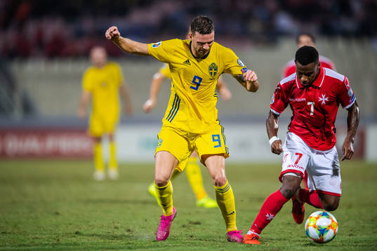 Marcus Berg of Sweden and Joseph Mbong of Malta