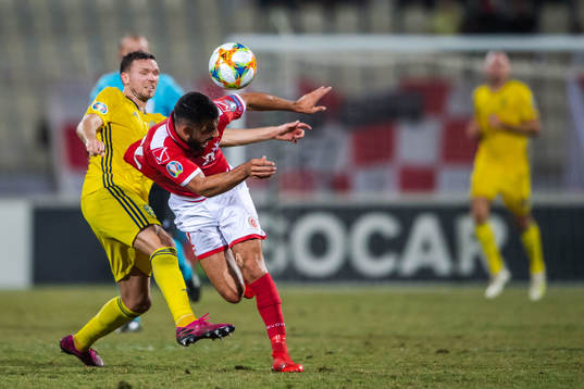 Marcus Berg of Sweden and Zach Muscat of Malta