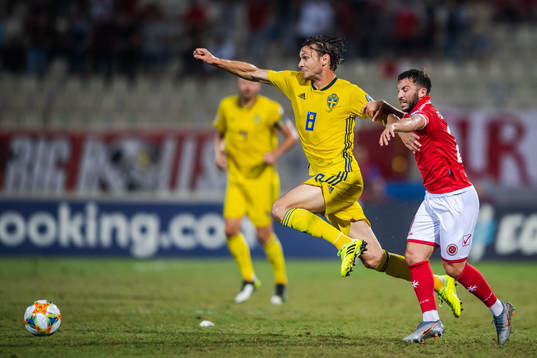 Albin Ekdal of Sweden and Jonathan Caruana of Malta