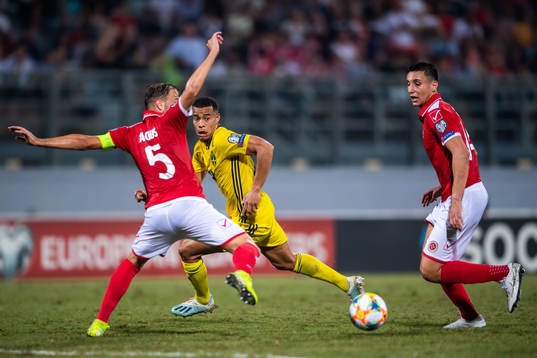 Andrei Agius and Kurt Shaw of Malta against Robin Quaison