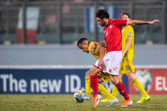 Robin Quaison of Sweden and Rowen Muscat of Malta