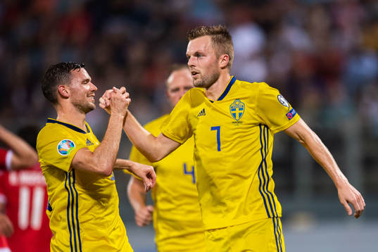 Marcus Berg and Sebastian Larsson of Sweden celebrate