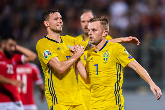 Marcus Berg and Sebastian Larsson of Sweden celebrate
