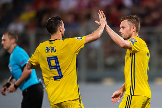 Marcus Berg and Sebastian Larsson of Sweden celebrate