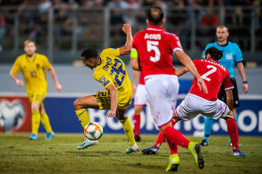 Robin Quaison of Sweden and Jonathan Caruana of Malta