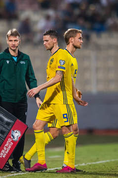 Marcus Berg changes with Sebastian Andersson of Sweden