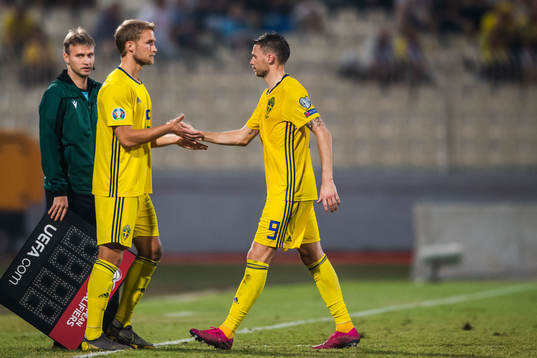 Marcus Berg changes with Sebastian Andersson of Sweden
