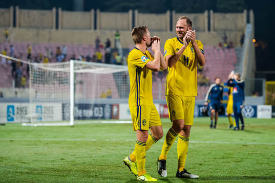 Sebastian Larsson and Andreas Granqvist of Sweden celebrate