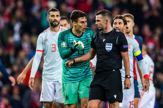 Goalkeeper Kepa Arrizabalaga in a conversation with referee