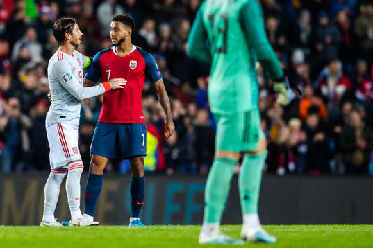 Sergio Ramos of Spain and Joshua King of Norway