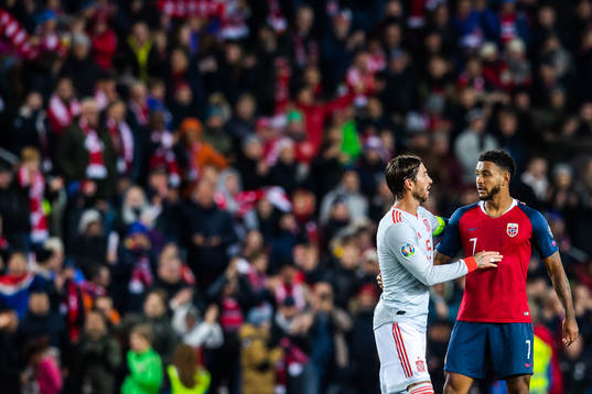 Sergio Ramos of Spain and Joshua King of Norway