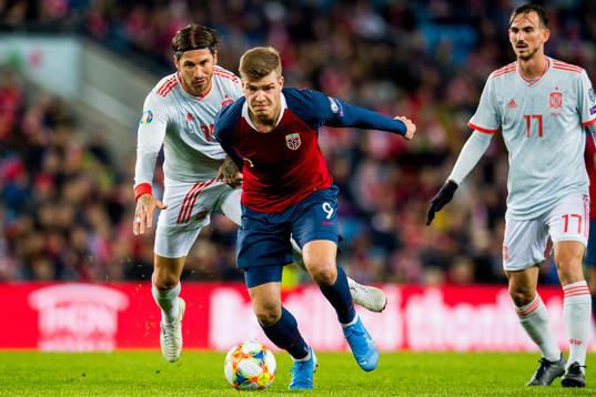 Sergio Ramos of Spain and Alexander Sørloth of Norway