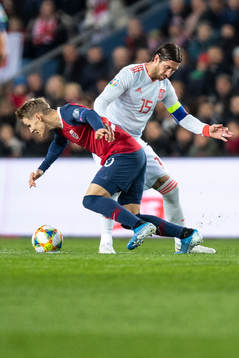 Martin Ødegaard of Norway and Sergio Ramos of Spain