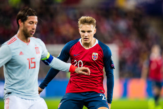 Sergio Ramos of Spain and Martin Ødegaard of Norway