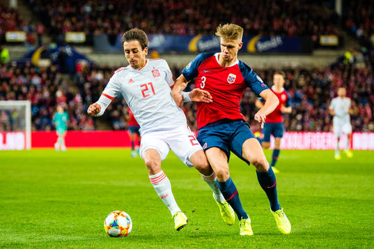 Mikel Oyarzabal of Spain and Kristoffer Ajer of Norway