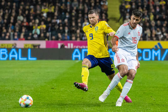 Marcus Berg of Sweden and Rodri of Spain